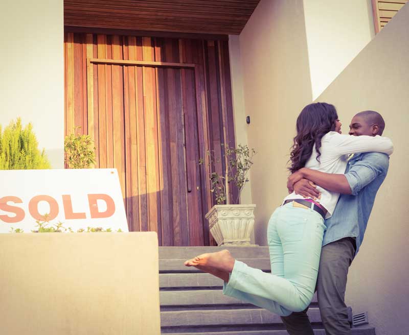 New home owners happy that they just finished their real estate closing